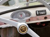 a steering wheel and dashboard of an old car