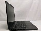 a black laptop computer sitting on a white surface