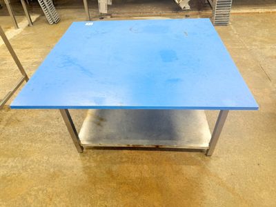 a blue table that is sitting on the floor
