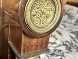 a wooden pole with a clock on top of it