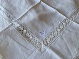 a white table cloth with a square design on it