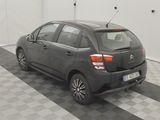 a picture of a small car parked in a garage