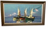 framed oil painting of a sailboat in a calm sea