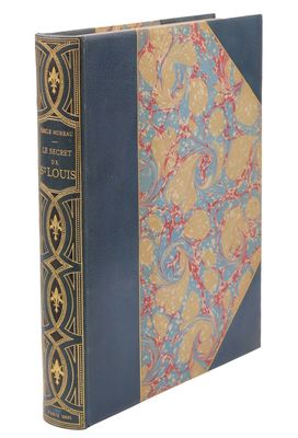 un vieux livre avec une couverture bleue et une couverture jaune et bleue