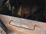 a metal box with a handle that is inside of it
