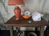 a small table with a lamp on top of it