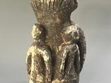 statue of a woman holding a child in her arms
