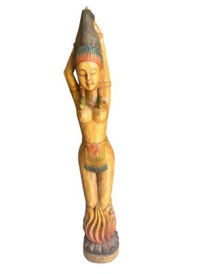 wooden statue of a woman with a hat on her head and hands behind her head