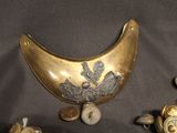 a lot of gold and silver objects on a black surface