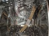 a close up of a washer with a lot of water inside of it