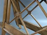 a close up of a wooden bench with a wooden frame