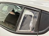 a car that has a broken window and a broken screen