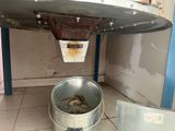 a bucket that is sitting on the floor next to a trash can