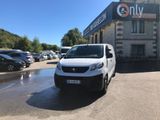 a white van parked in front of a building