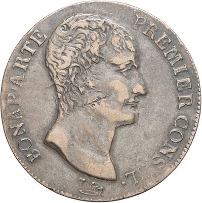 a close up of a coin with a man ' s face on it