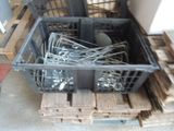 many pieces of metal in a crate on the pallets