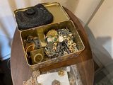 a small table with a lot of jewelry on it