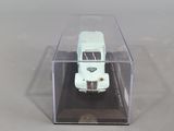 a small white truck in a clear box