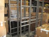 a metal rack that is in a warehouse with boxes