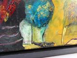 un tableau représentant un chat assis sur une table