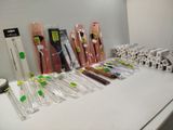 a lot of different types of toothbrushes on the counter