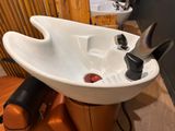 a sink with a hair dryer and a hair dryer in it