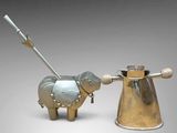 two metal animals that are standing next to each other