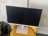 a yellow chair with a computer on top of it
