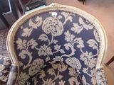 a blue and white chair that is in a room