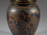 a vase that is sitting on a white surface