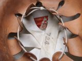 a close up of a baseball glove with a tag on it