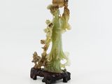 chinese carved jade figurine of a lady with a basket of flowers