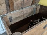 a wooden box that has some wires inside of it