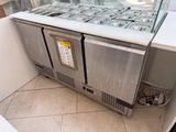 a counter that has a lot of food on it