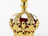 gold crown with red velvet and gold decoration on white background