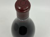 a bottle of wine that is sitting on a table