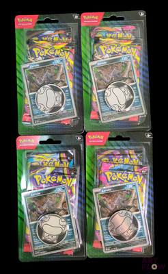 three packs of pokemon trading cards are in the packaging