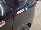 a car with a sticker on the side of it ' s door