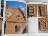 an open book with a picture of a church in the middle of it
