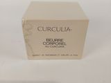 a box of cream on a white surface with a white background