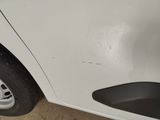 a close up of a white car with a flat tire
