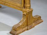 a gold bed with a wooden headboard and foot rest
