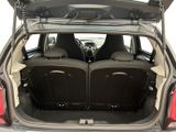 two seats in the back of a car with the trunk open