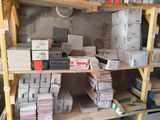 many boxes and boxes on the shelves in the room