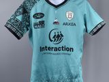 a blue jersey with a black and white design on it