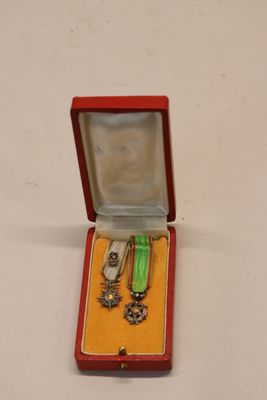a small red box with a bunch of items inside of it