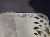 a close up of a white towel with a tag on it