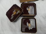 three small trays with a picture of a woman on them