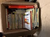 a cardboard box with a bunch of books on it