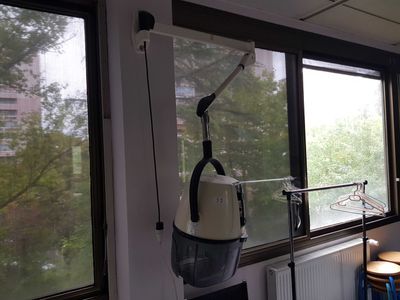 a hospital room with a hospital bed and a window with a view of the city